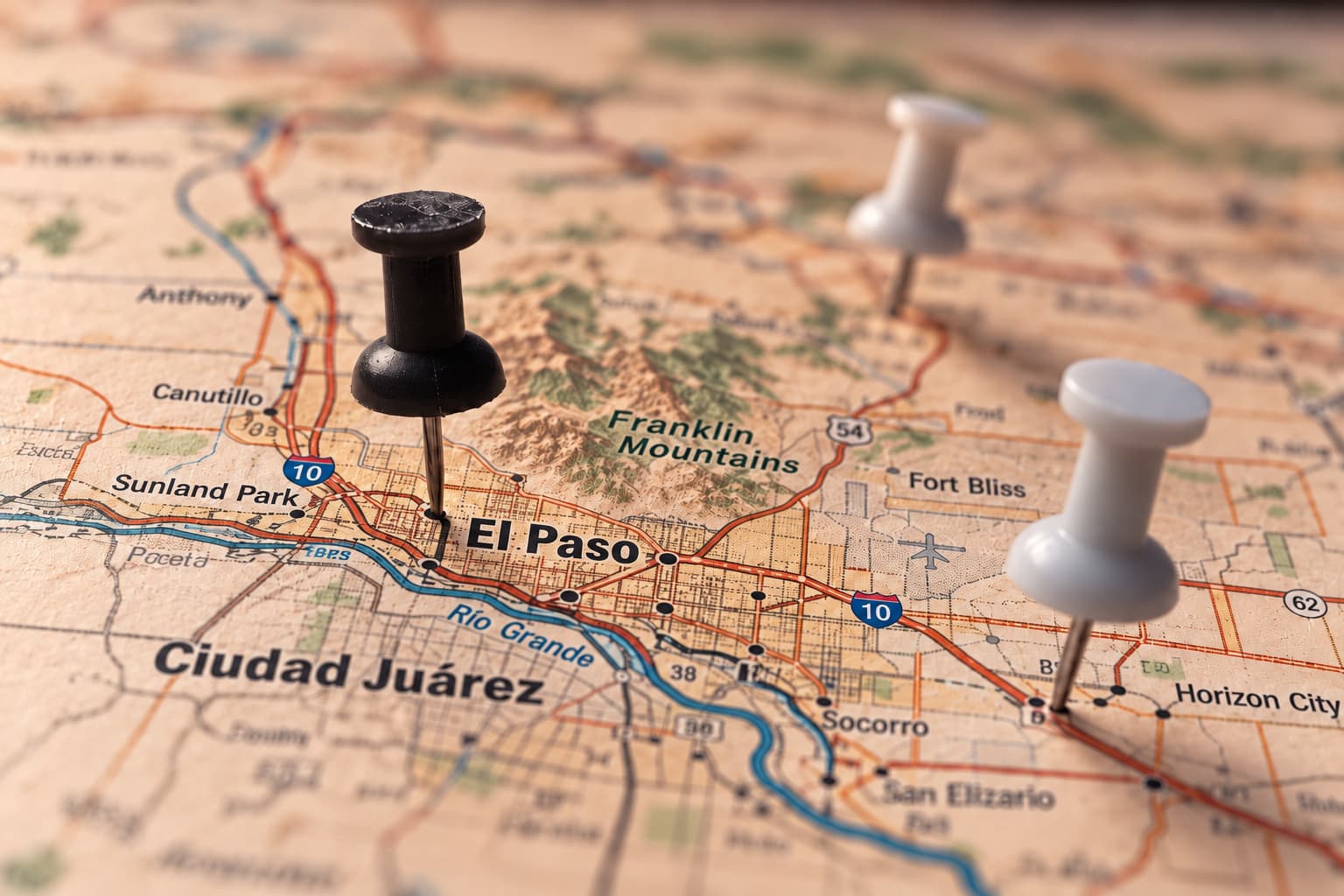 Black-and-white map of El Paso with pushpins marking the city, the Fort Bliss area and Horizon City